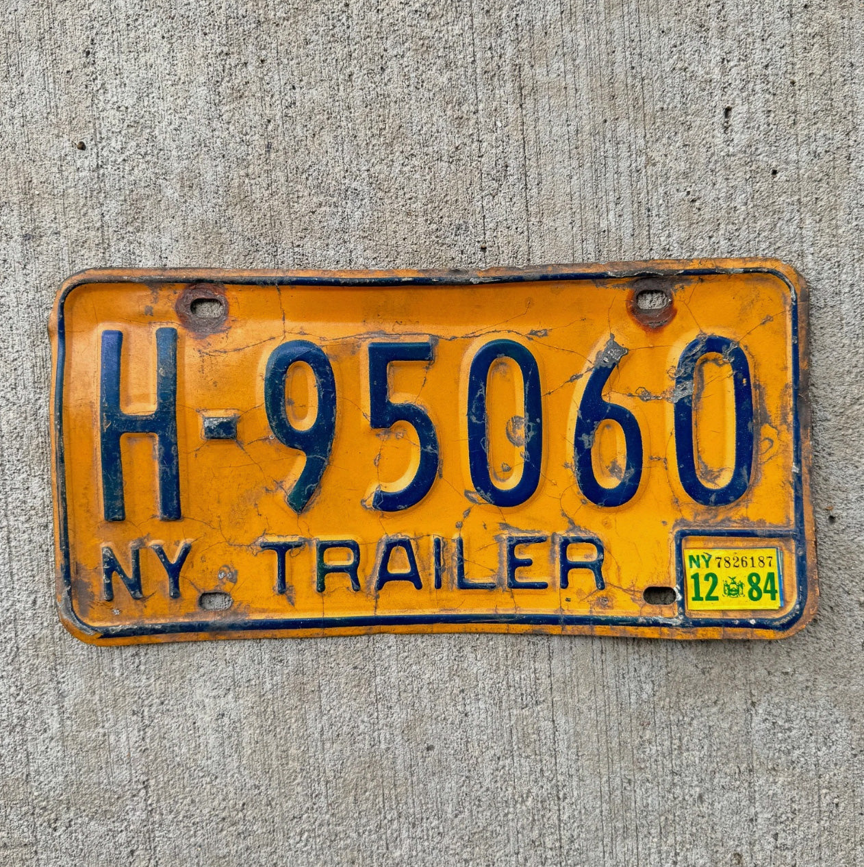 Photo of a 1973 1986 New York Trailer License Plate Auto Tag Garage Decor Vintage Orange H 95060