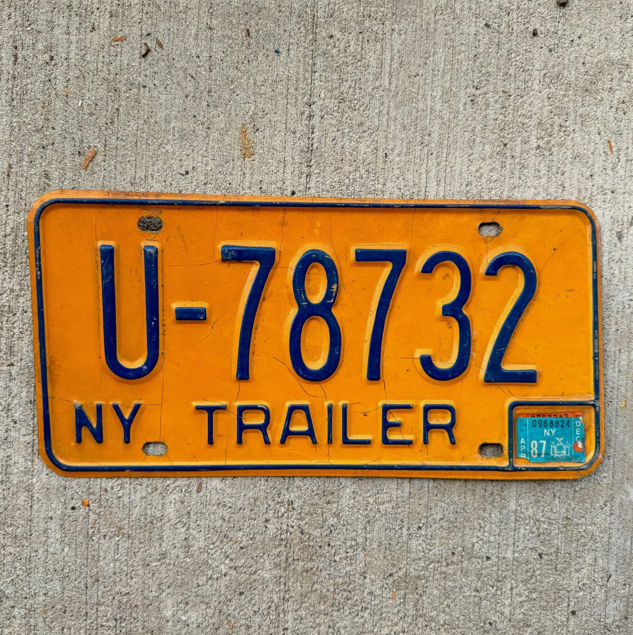 Photo of a 1973 1986 New York Trailer License Plate Auto Tag Garage Decor Vintage Orange U 78732