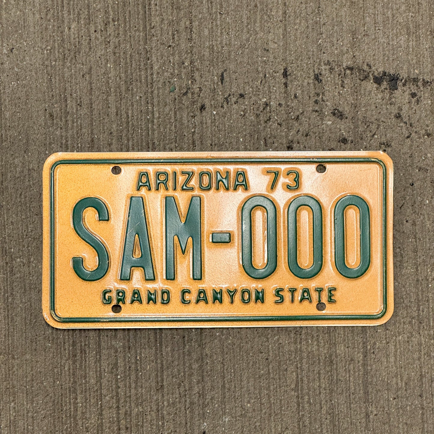 Photo of a 1973 Arizona SAMPLE License Plate Auto Tag Garage Decor Vintage SAM 000