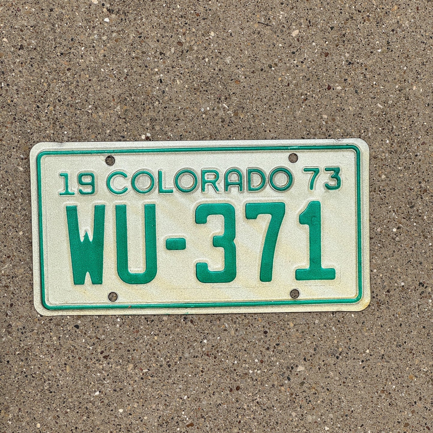 Photo of a 1973 Colorado Motorcycle License Plate Auto Tag Garage Decor Vintage WU 371