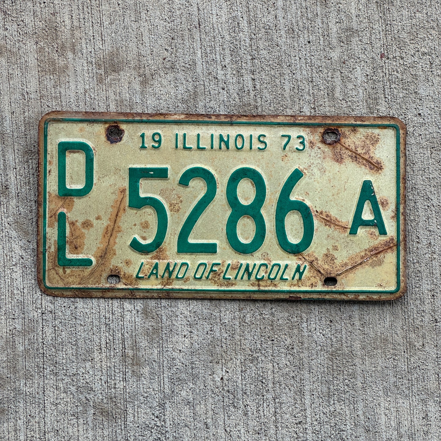 Photo of a 1973 Illinois Dealer License Plate Auto Tag 1 Vintage Garage 5286 A with original patina
