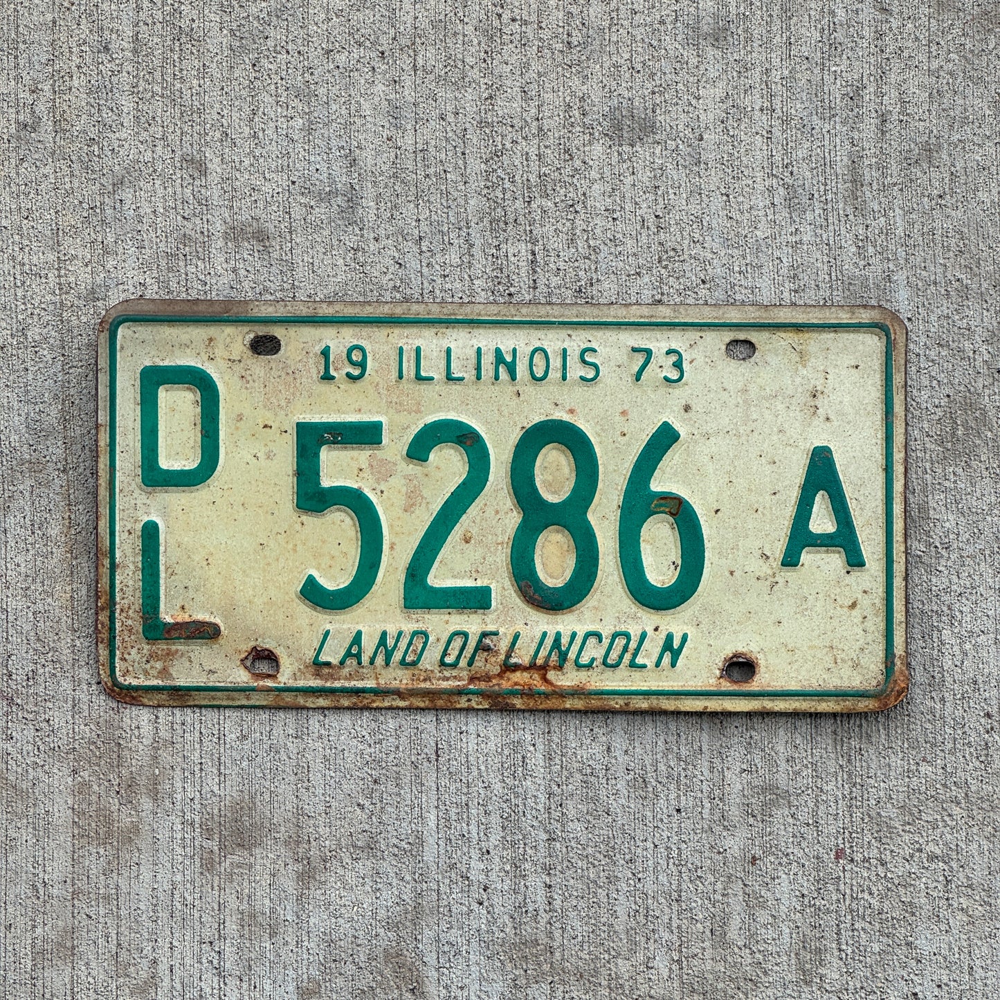 Photo of a 1973 Illinois Dealer License Plate Auto Tag 2 Vintage Garage 5286 A with original patina
