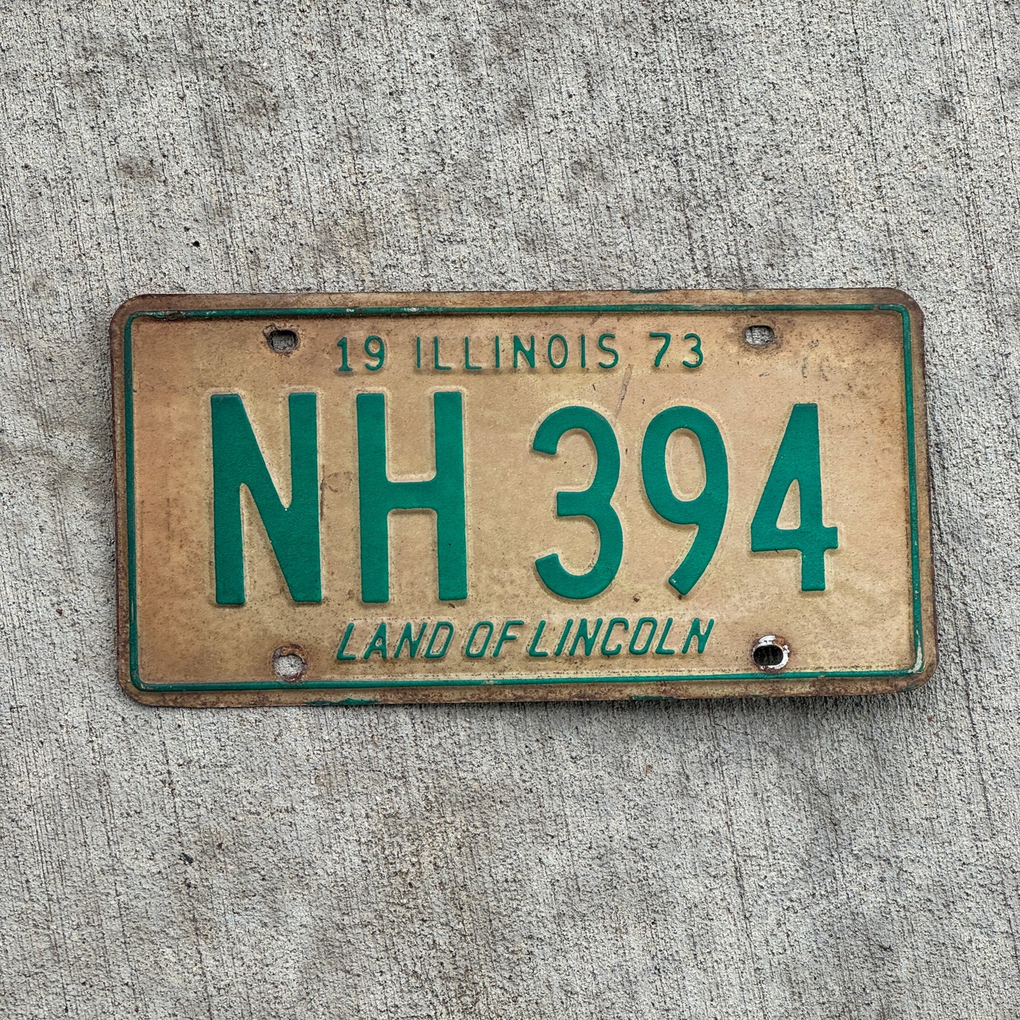 Photo of a 1973 Illinois License Plate Auto Tag 1 Vintage Garage NH 394 with original patina