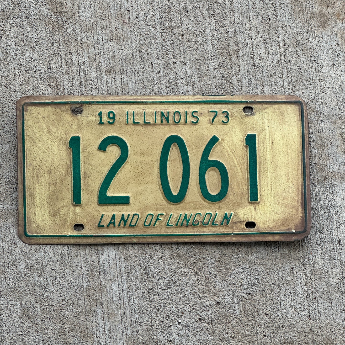 Photo of a 1973 Illinois License Plate Auto Tag 2 Vintage Garage 12 061 with original patina