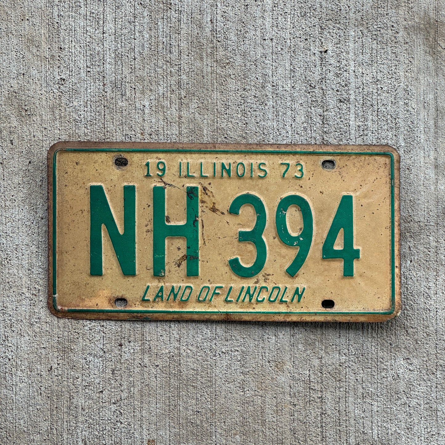 Photo of a 1973 Illinois License Plate Auto Tag 2 Vintage Garage NH 394 with original patina