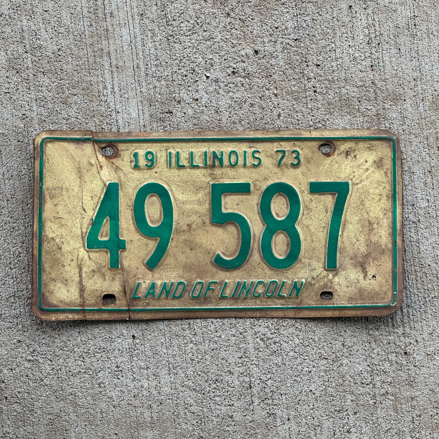 Photo of a 1973 Illinois License Plate Auto Tag Garage Decor Vintage 49 587 with original patina