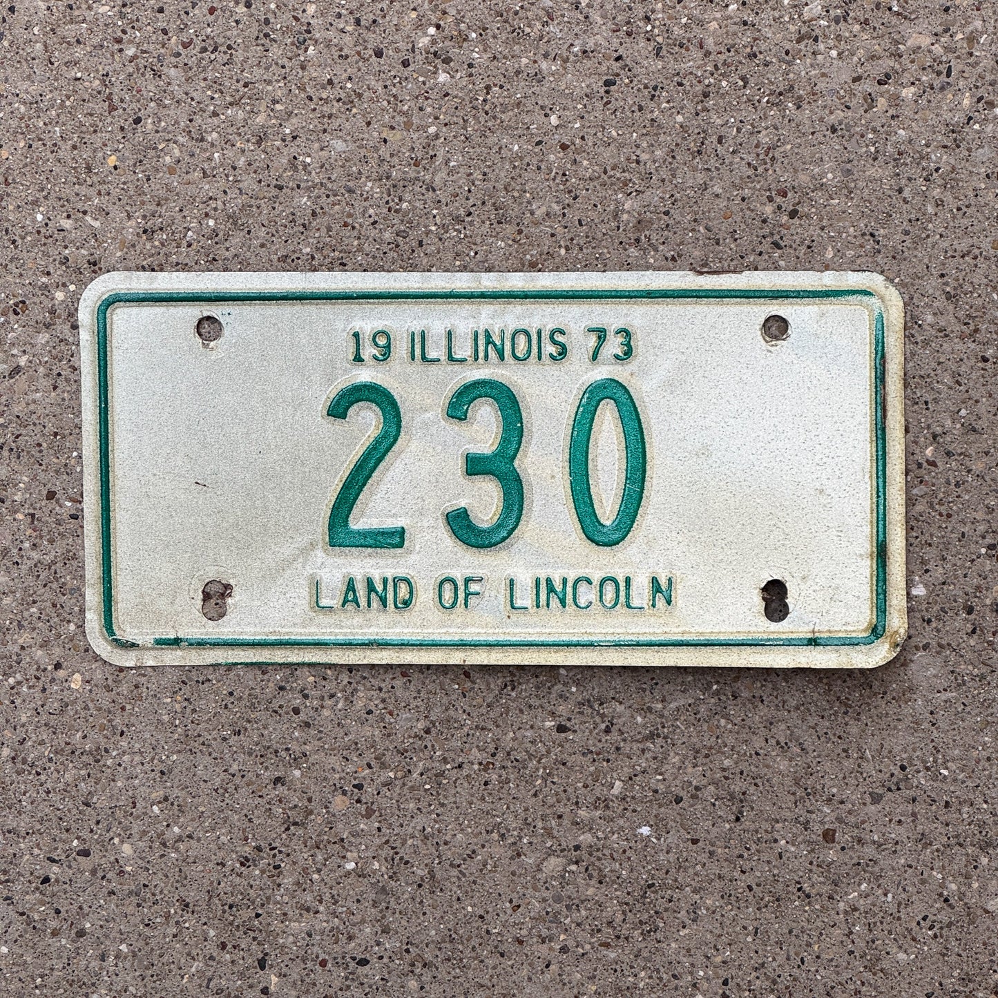 Photo of a 1973 Illinois Motorcycle License Plate Auto Tag Garage Decor Vintage Low Number Three Digit 230 with original patina