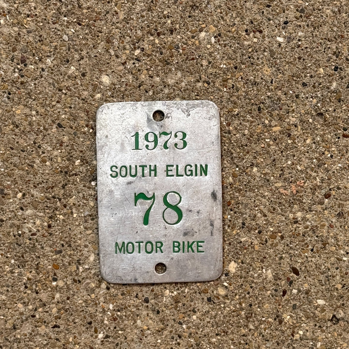 Photo of a 1973 Illinois Motorcycle Tax Tag Auto Tag Garage Decor Vintage South Elgin 78