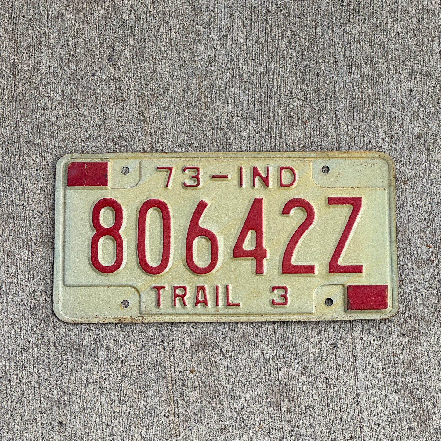 Photo of a 1973 Indiana Trailer License Plate Auto Tag Garage Decor Vintage 80642 Z with original patina