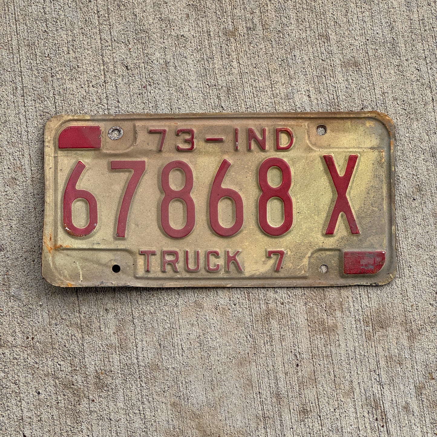 Photo of a 1973 Indiana Truck License Plate Auto Tag Garage Decor Vintage 67868 X with original patina