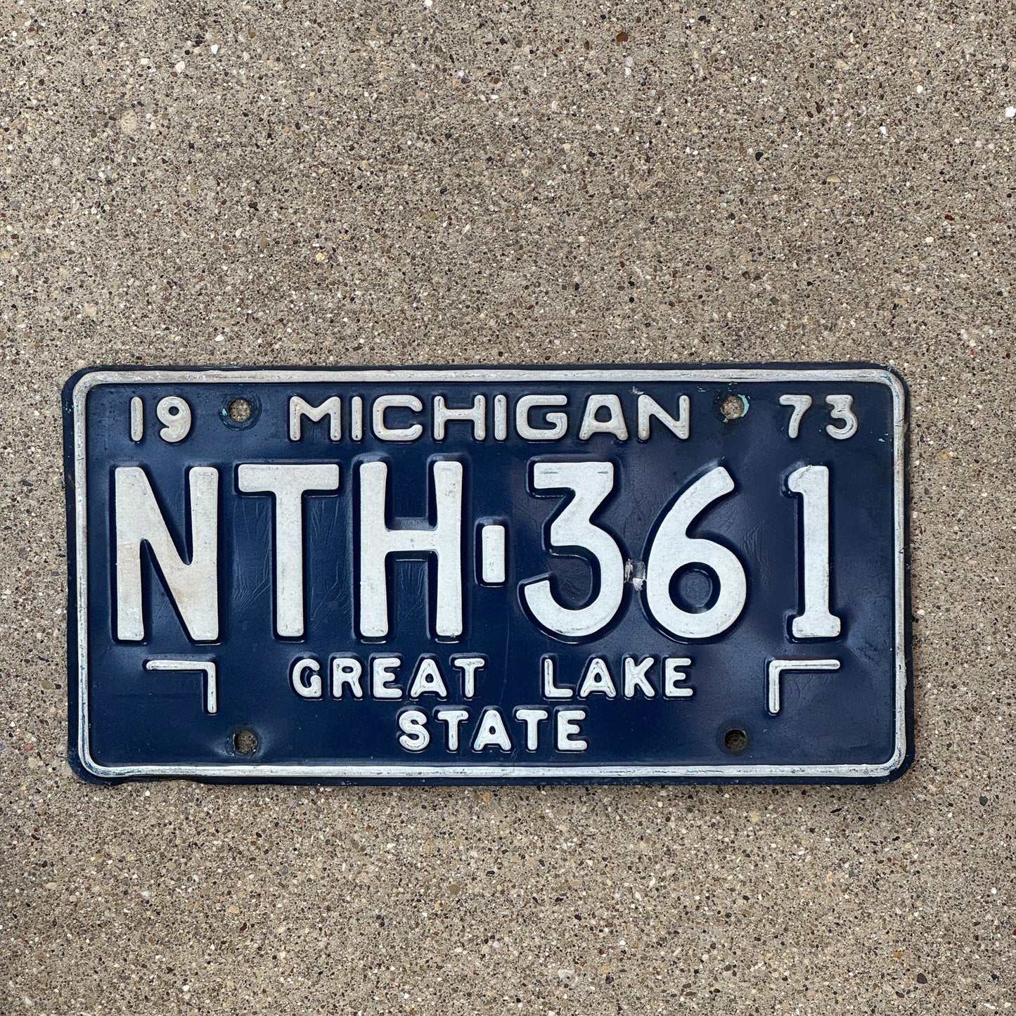 Photo of a 1973 Michigan License Plate Auto Tag Garage Decor Vintage NTH 361