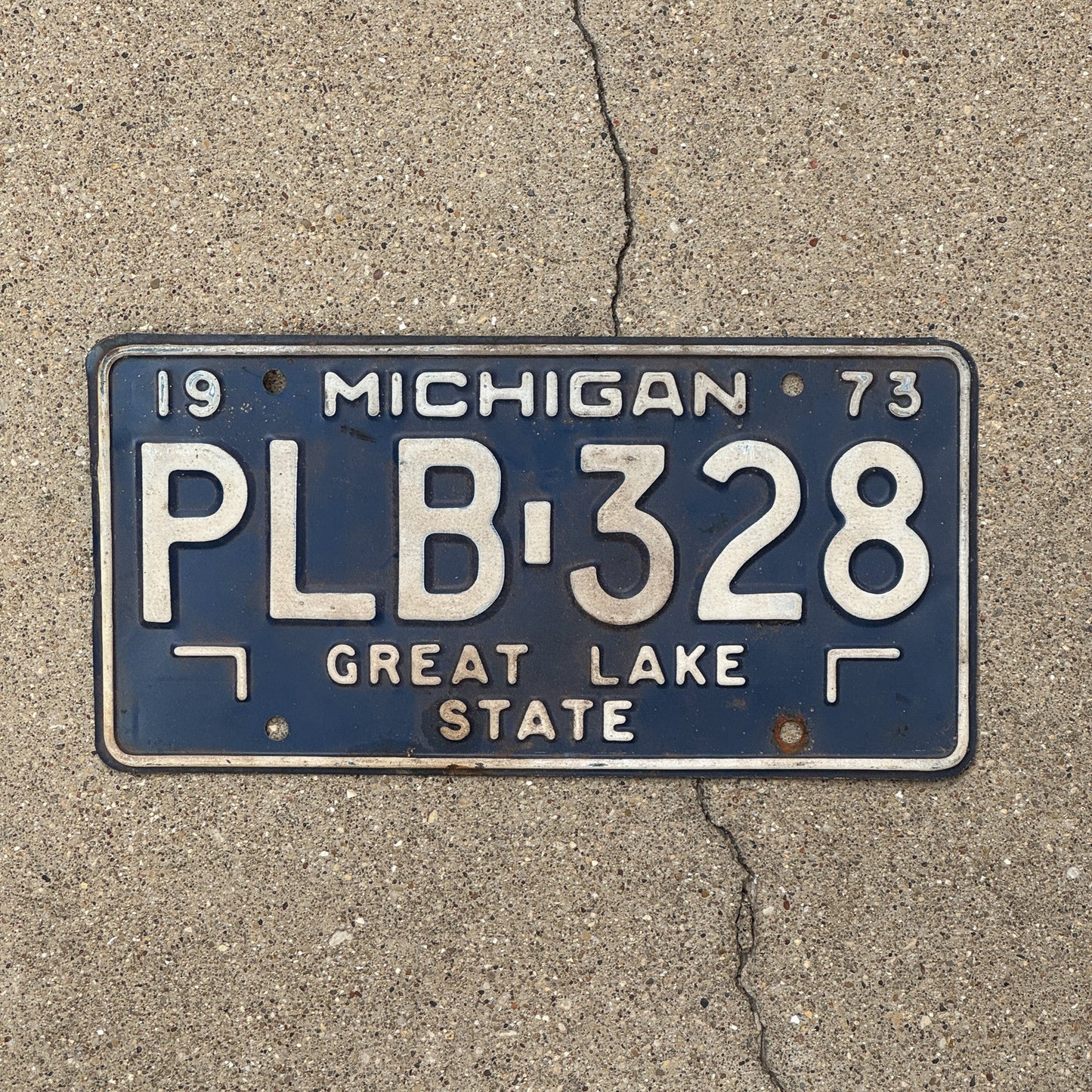 Photo of a 1973 Michigan License Plate Auto Tag Garage Decor Vintage PLB 328