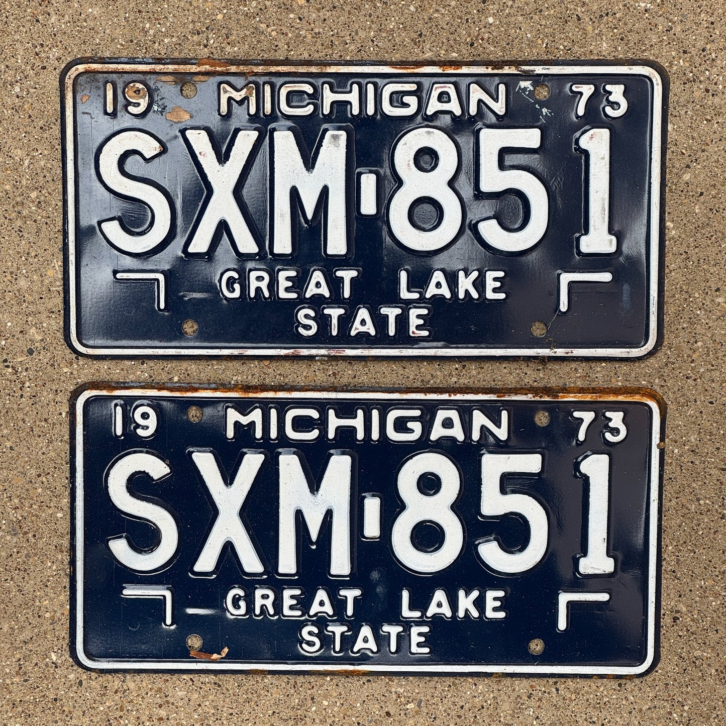Photo of a 1973 Michigan License Plate Pair Auto Tag Garage Decor Vintage SXM 851