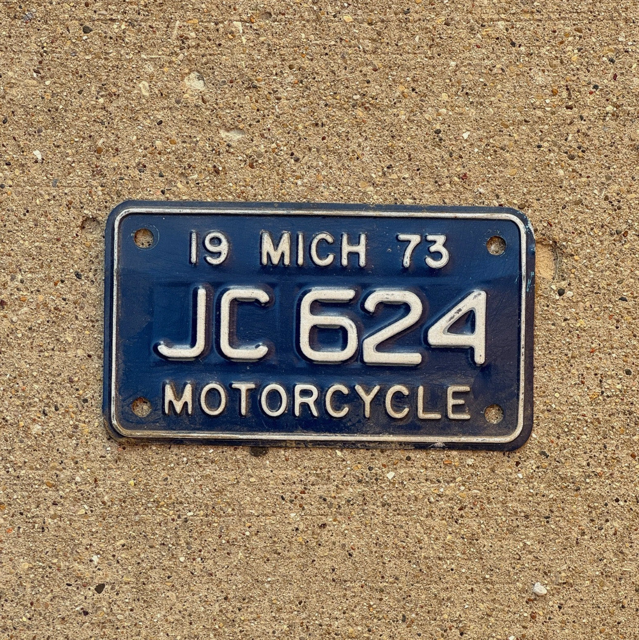 Photo of a 1973 Michigan Motorcycle License Plate Auto Tag Garage Decor Vintage JC 624