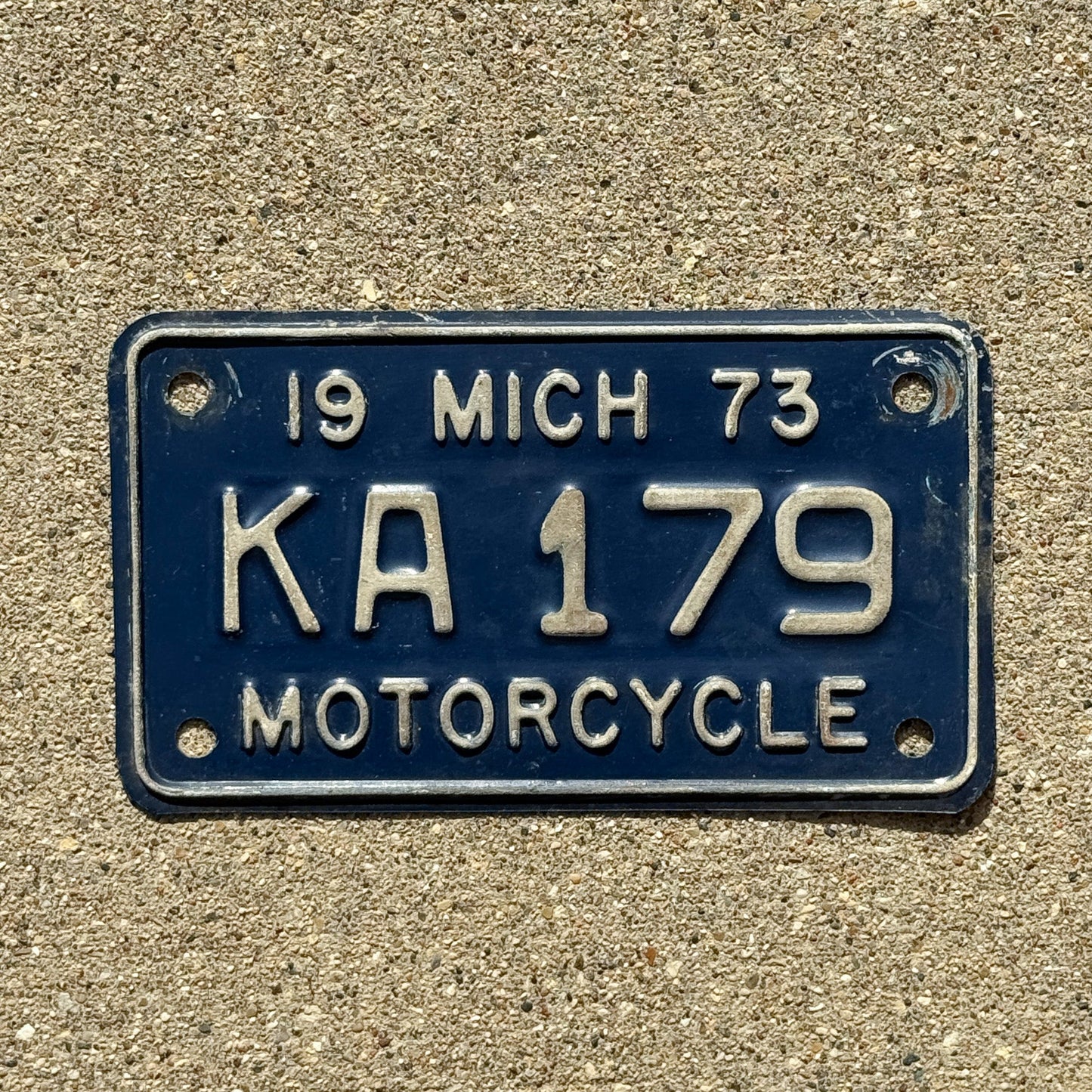 Photo of a 1973 Michigan Motorcycle License Plate Auto Tag Garage Decor Vintage KA 179