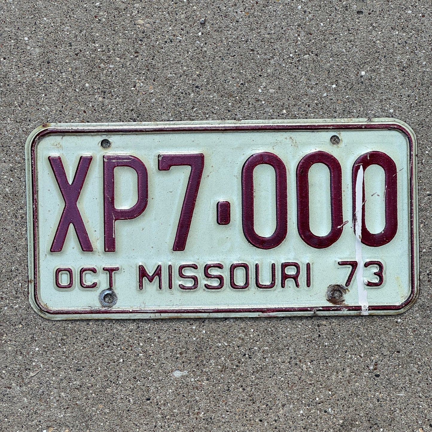Photo of a 1973 Missouri License Plate Auto Tag Garage Decor Vintage Fun Number XP 7000