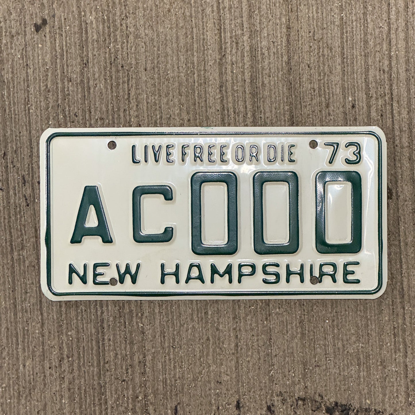 Photo of a 1973 New Hampshire SAMPLE License Plate Auto Tag Garage Decor Vintage AC 000