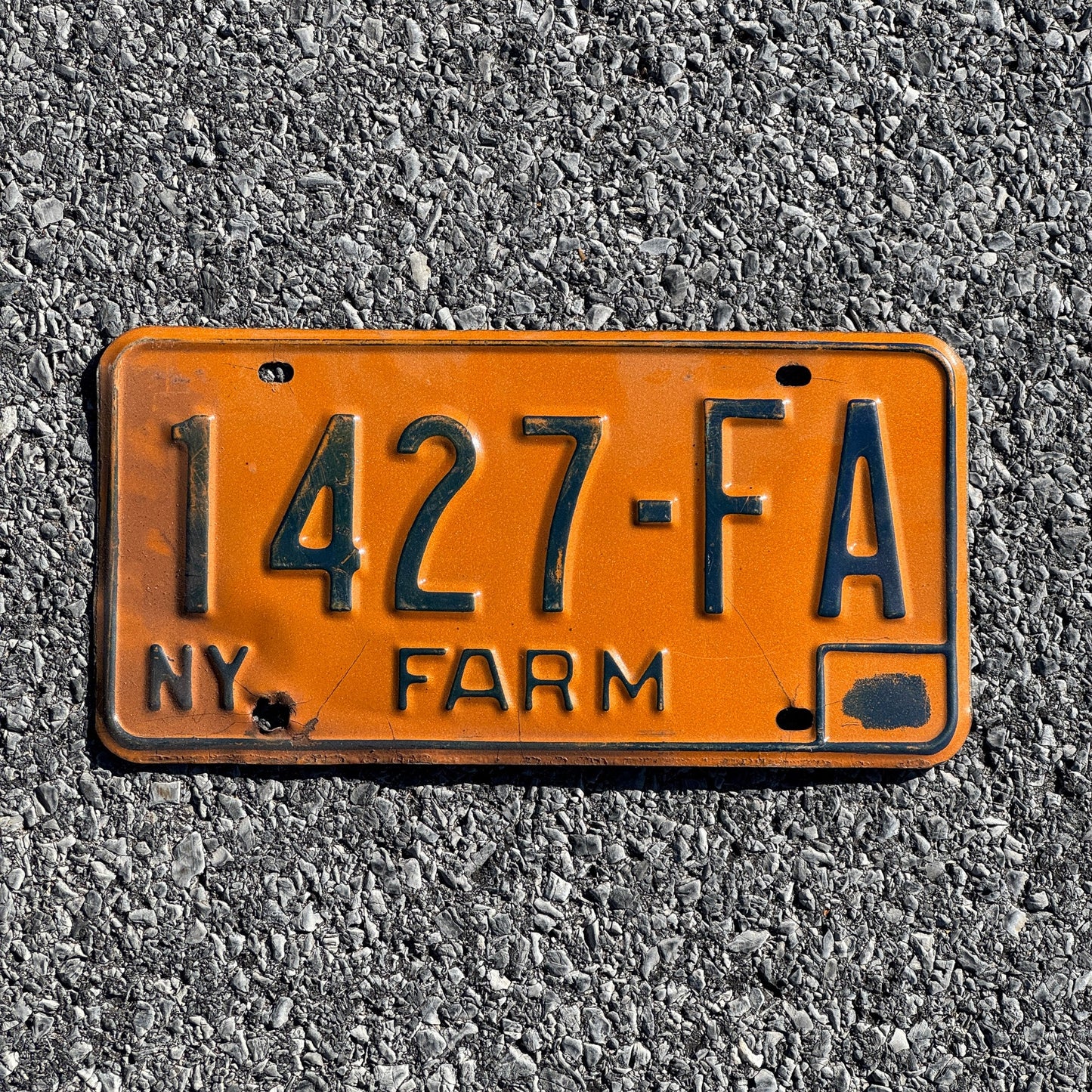 Photo of a 1973 New York Farm License Plate Auto Tag Garage Decor Vintage 1427 FA
