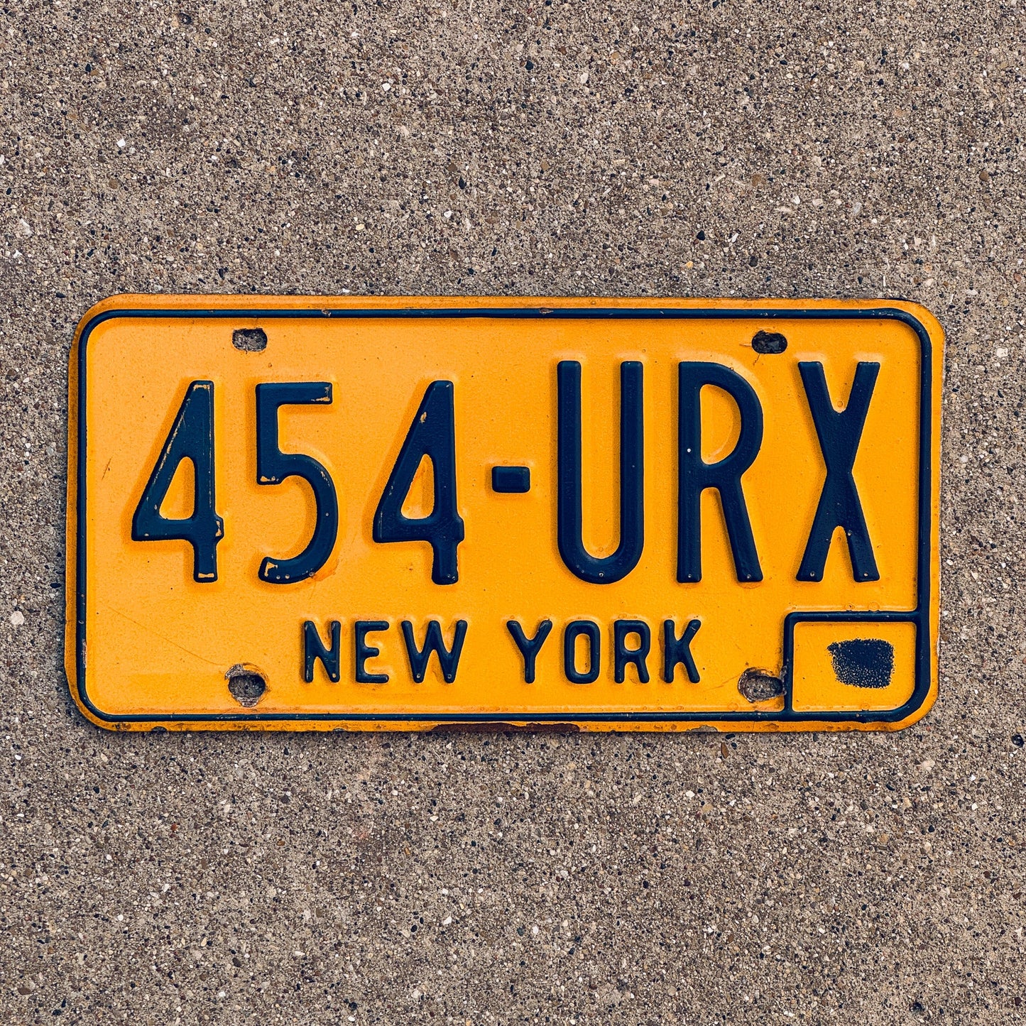 Photo of a 1973 New York License Plate Auto Tag Garage Decor Vintage 454 URX