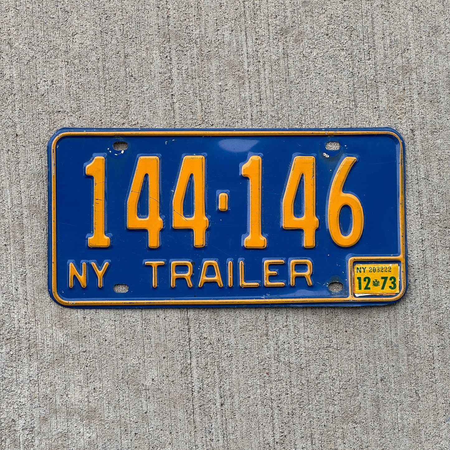Photo of a 1973 New York TRAILER License Plate Auto Tag Garage Decor Vintage 144 146