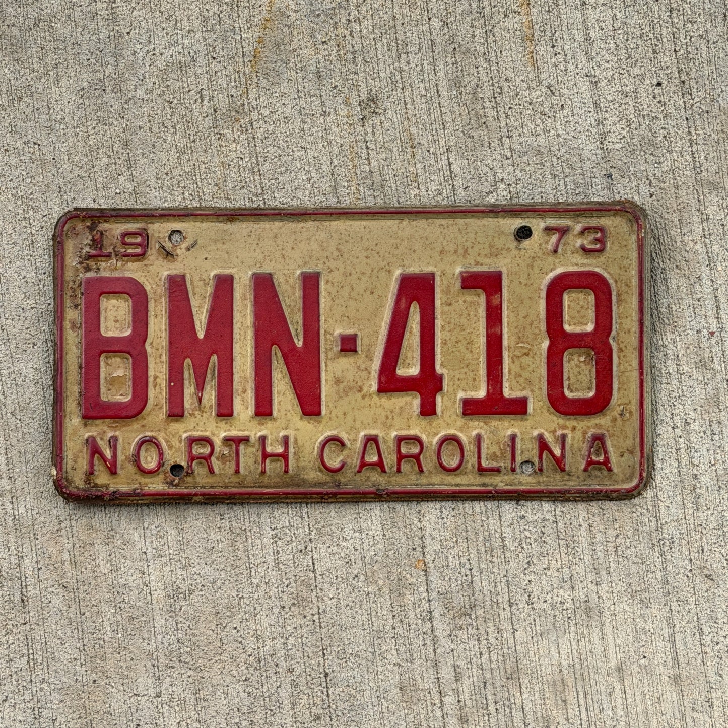 Photo of a 1973 North Carolina License Plate Auto Tag Garage Decor Vintage BMN 418 with original patina