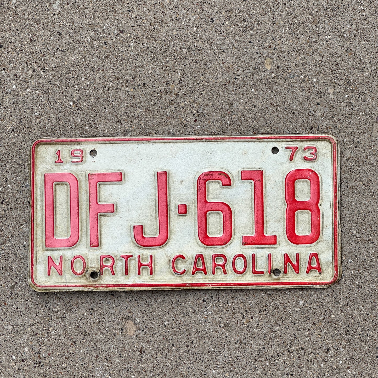 Photo of a 1973 North Carolina License Plate Auto Tag Garage Decor Vintage DFJ 618 with original patina
