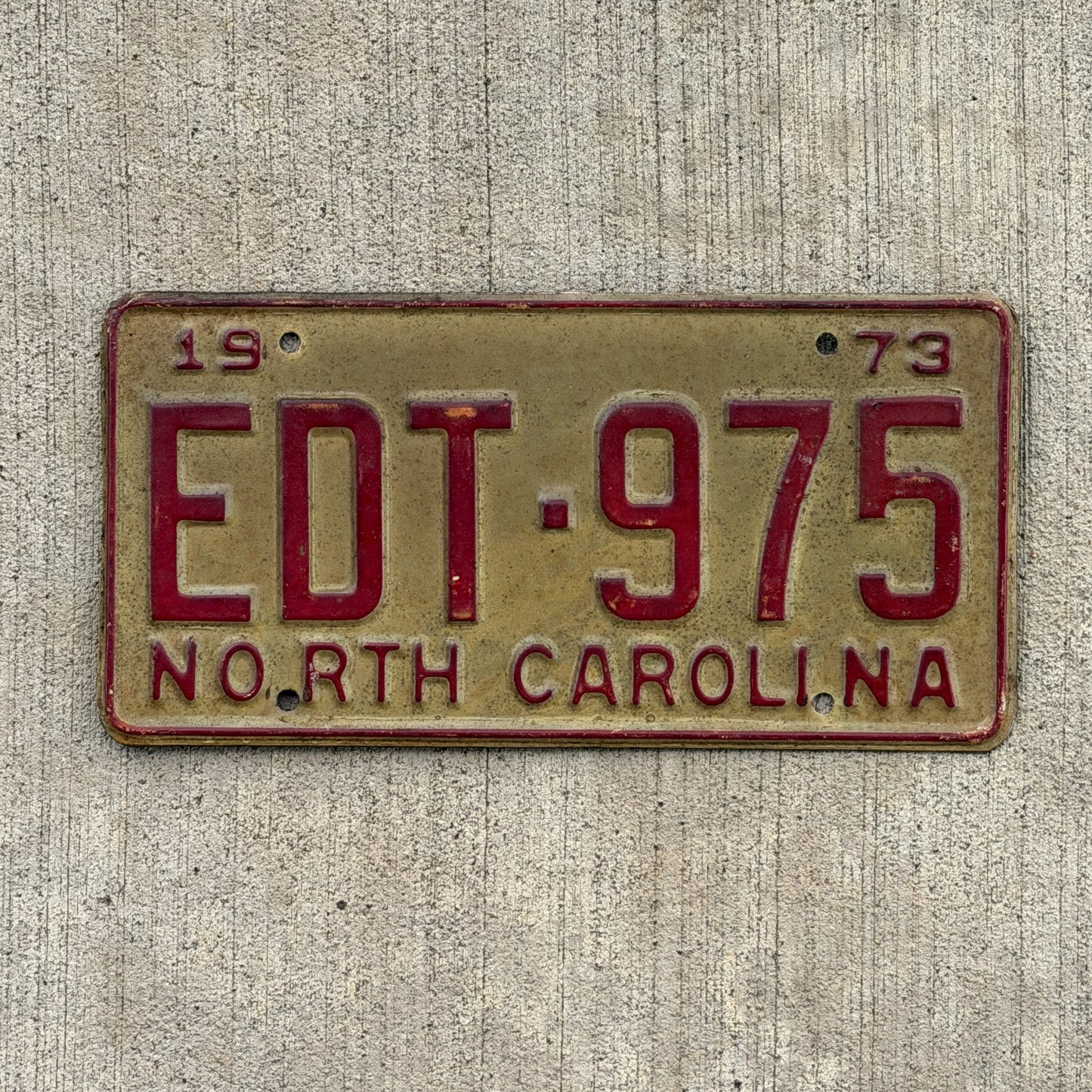 Photo of a 1973 North Carolina License Plate Auto Tag Garage Decor Vintage EDT 975 with original patina