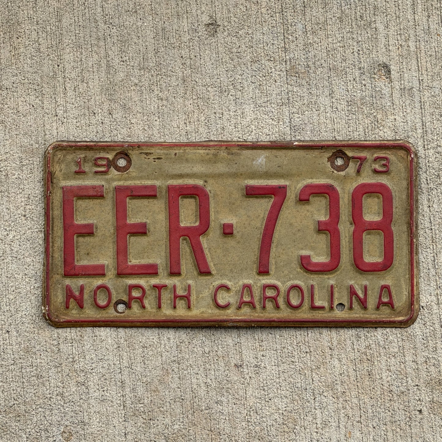 Photo of a 1973 North Carolina License Plate Auto Tag Garage Decor Vintage EER 738 with original patina