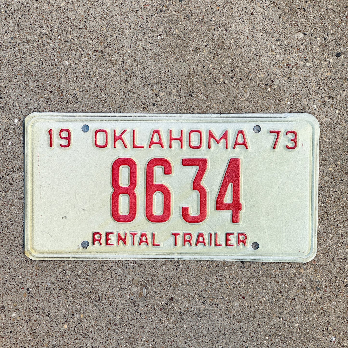 Photo of a 1973 Oklahoma Rental Trailer License Plate Auto Tag Garage Decor Vintage 8634 with original patina