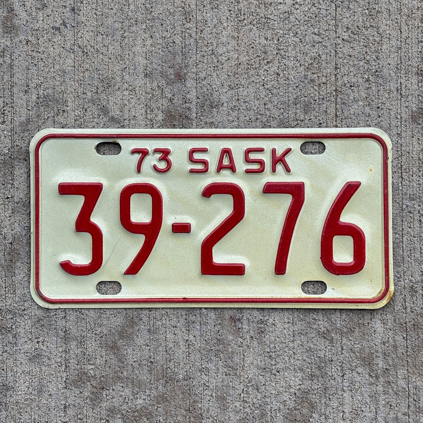 Photo of a 1973 Saskatchewan Motorcycle License Plate Auto Tag Garage Decor Vintage 39 276 with original patina