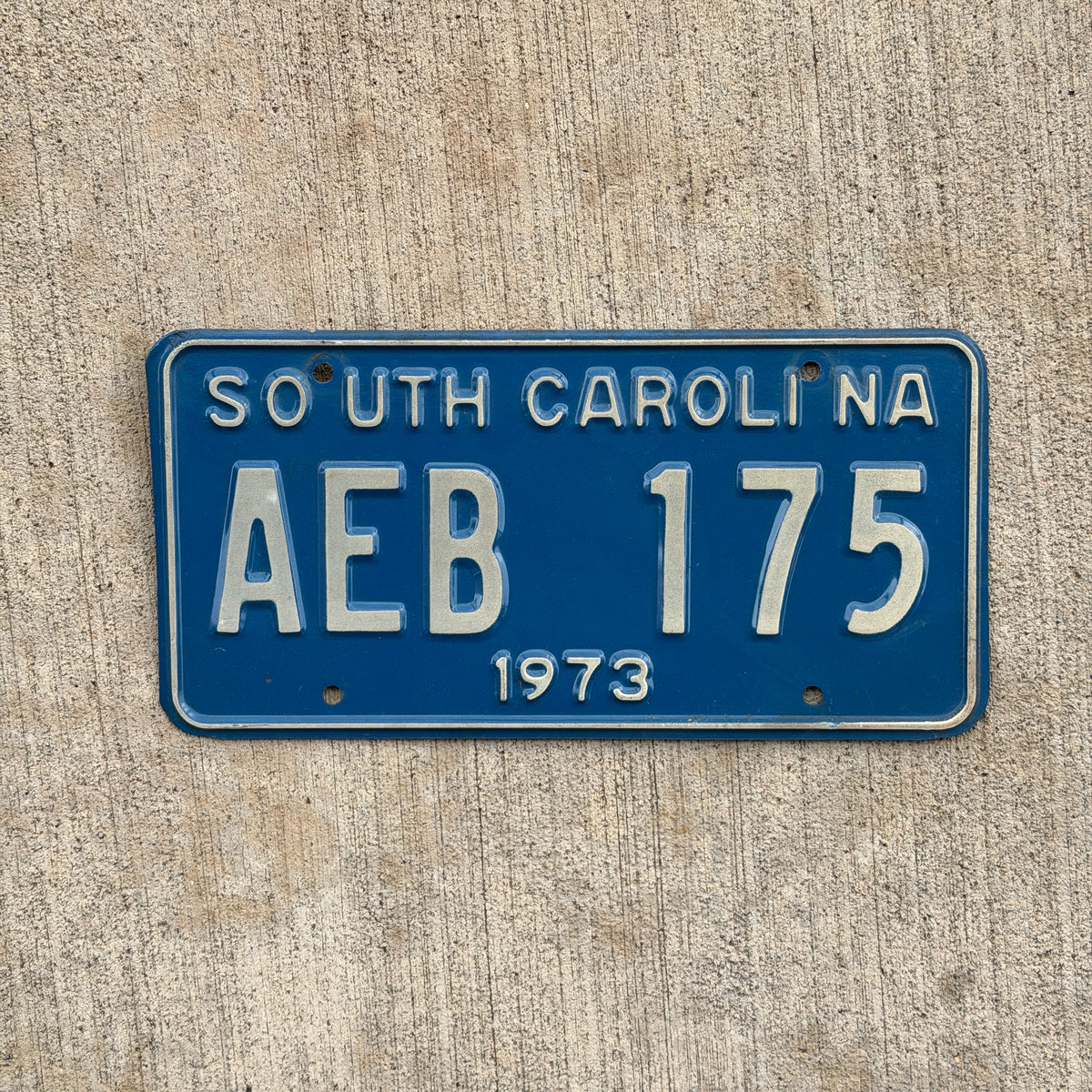 Photo of a 1973 South Carolina License Plate Auto Tag Garage Decor Vintage AEB 175 with original patina