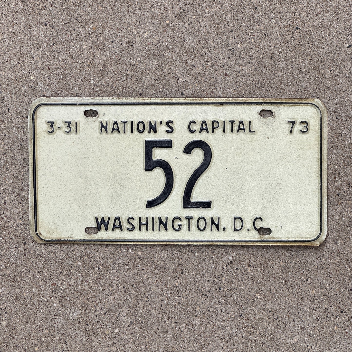 Photo of a 1973 Washington DC License Plate Auto Tag Garage Decor Vintage Low Number Two Digit 52 with original patina
