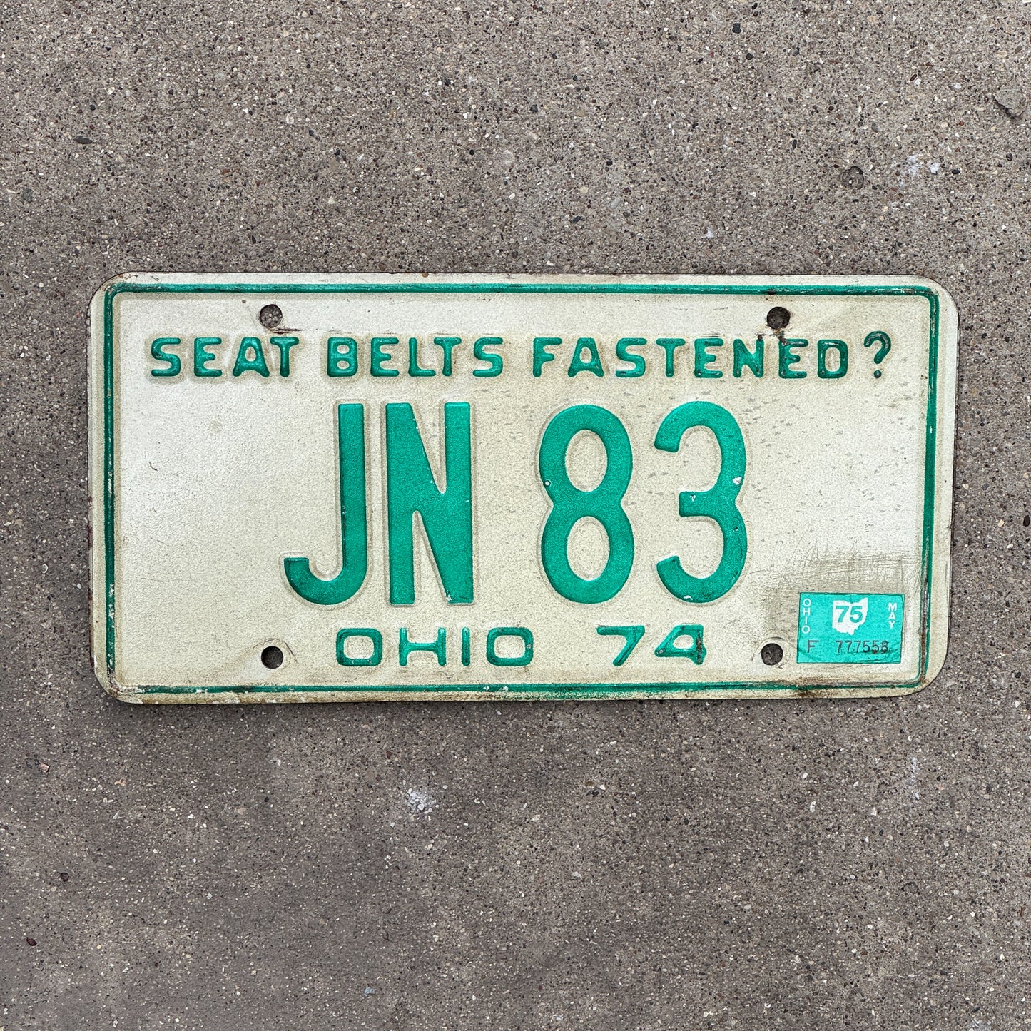 Photo of a 1974 1975 Ohio License Plate Auto Tag Garage Decor Vintage JN 83 with original patina