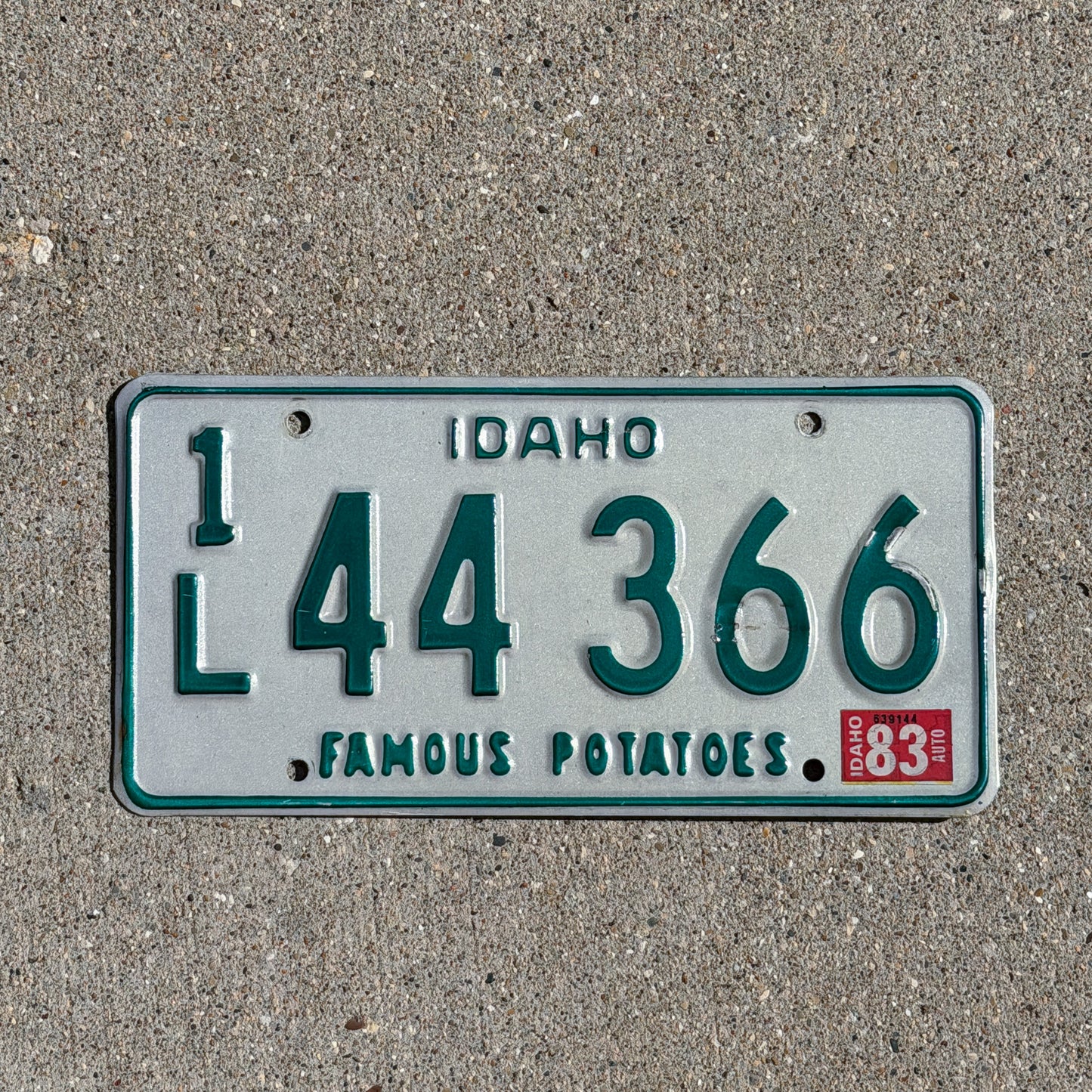 Photo of a 1974 1983 Idaho License Plate Auto Tag 1 Vintage Garage 1L 44 366 with original patina