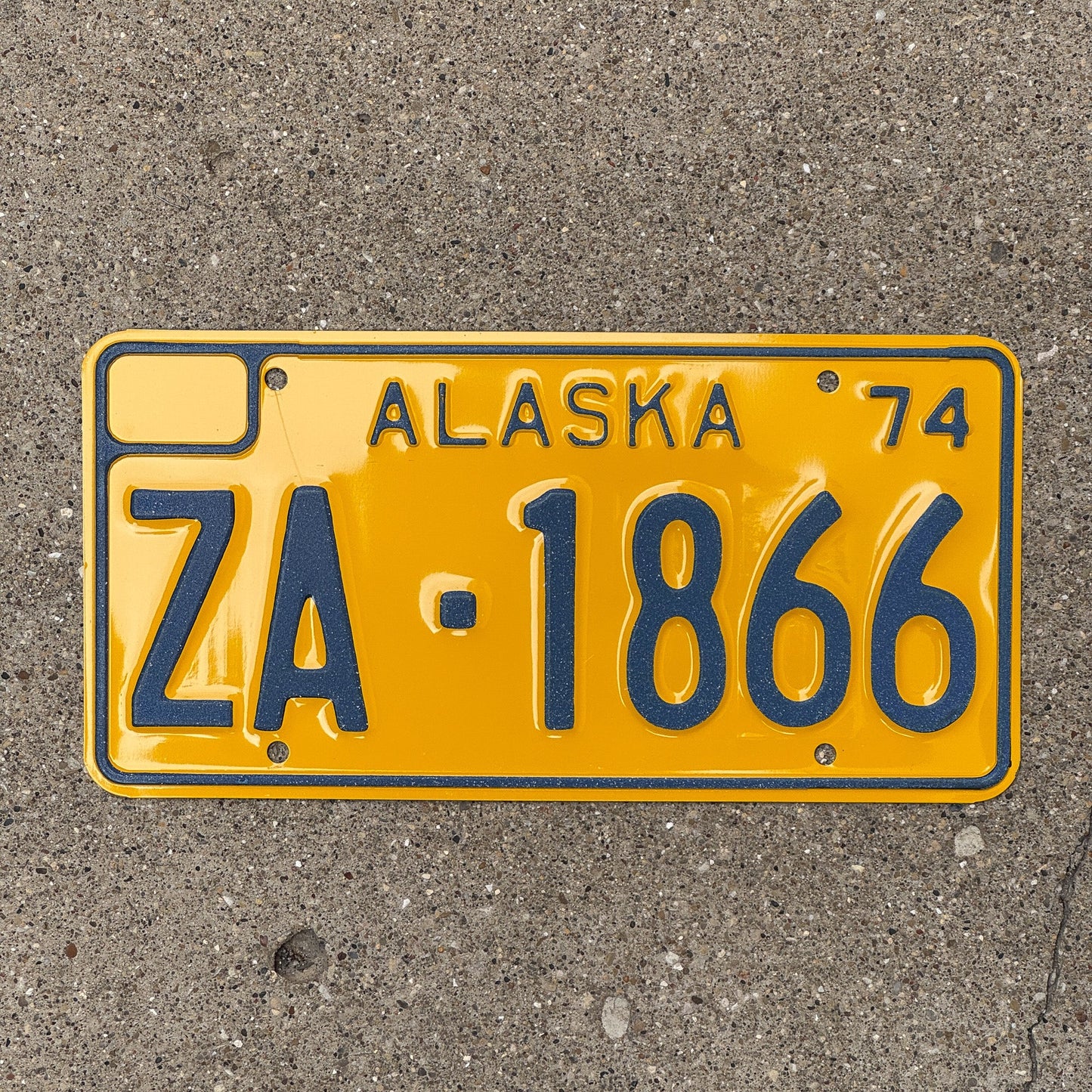 Photo of a 1974 Alaska FOR HIRE License Plate Auto Tag Garage Decor Vintage Reflective ZA 1866