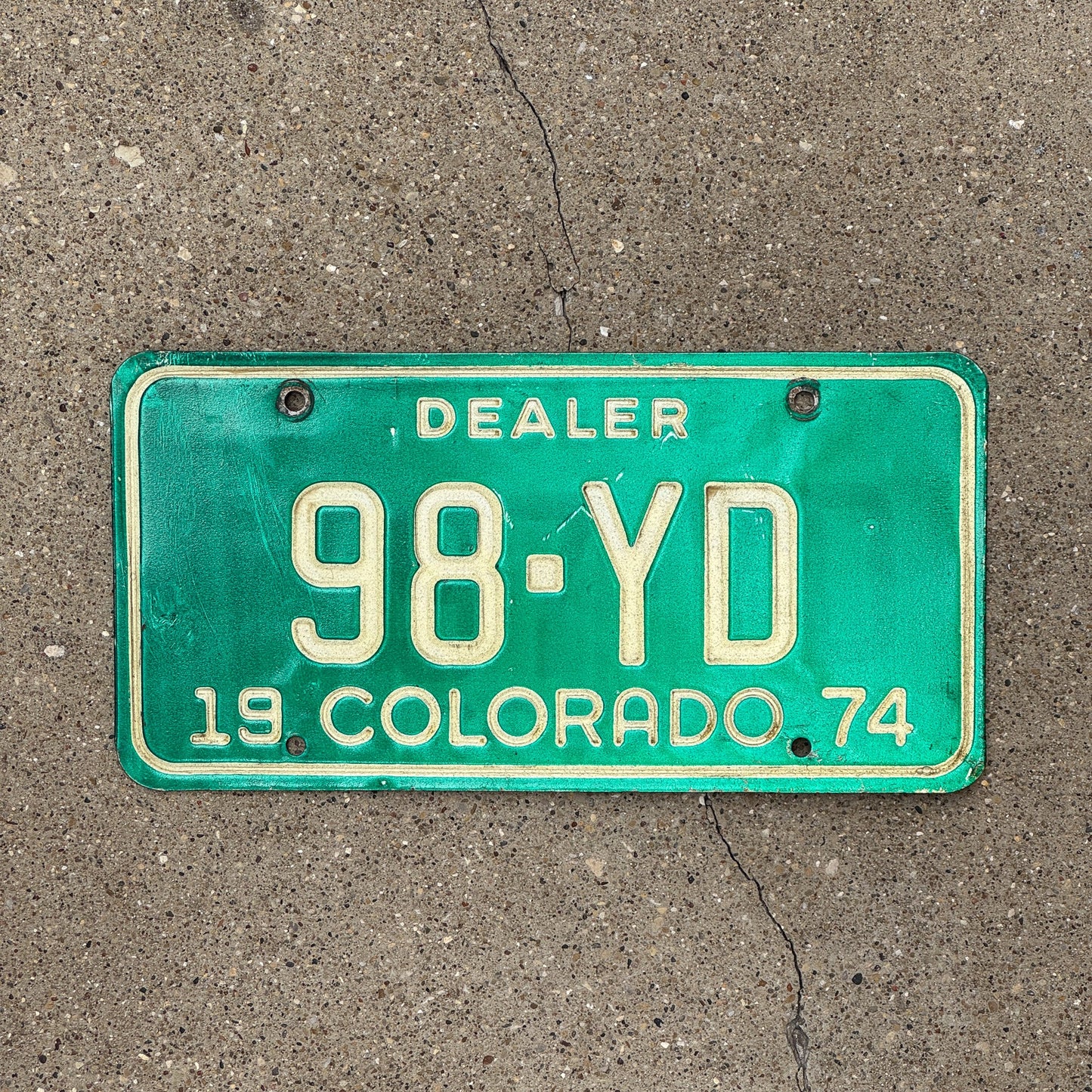 Photo of a 1974 Colorado Dealer License Plate Auto Tag Garage Decor Vintage 98 YD