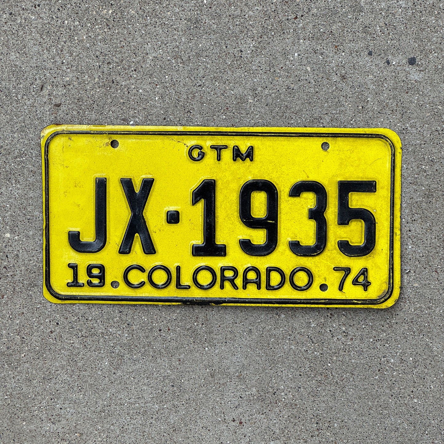 Photo of a 1974 Colorado GTM License Plate Auto Tag Garage Decor Vintage JX 1935