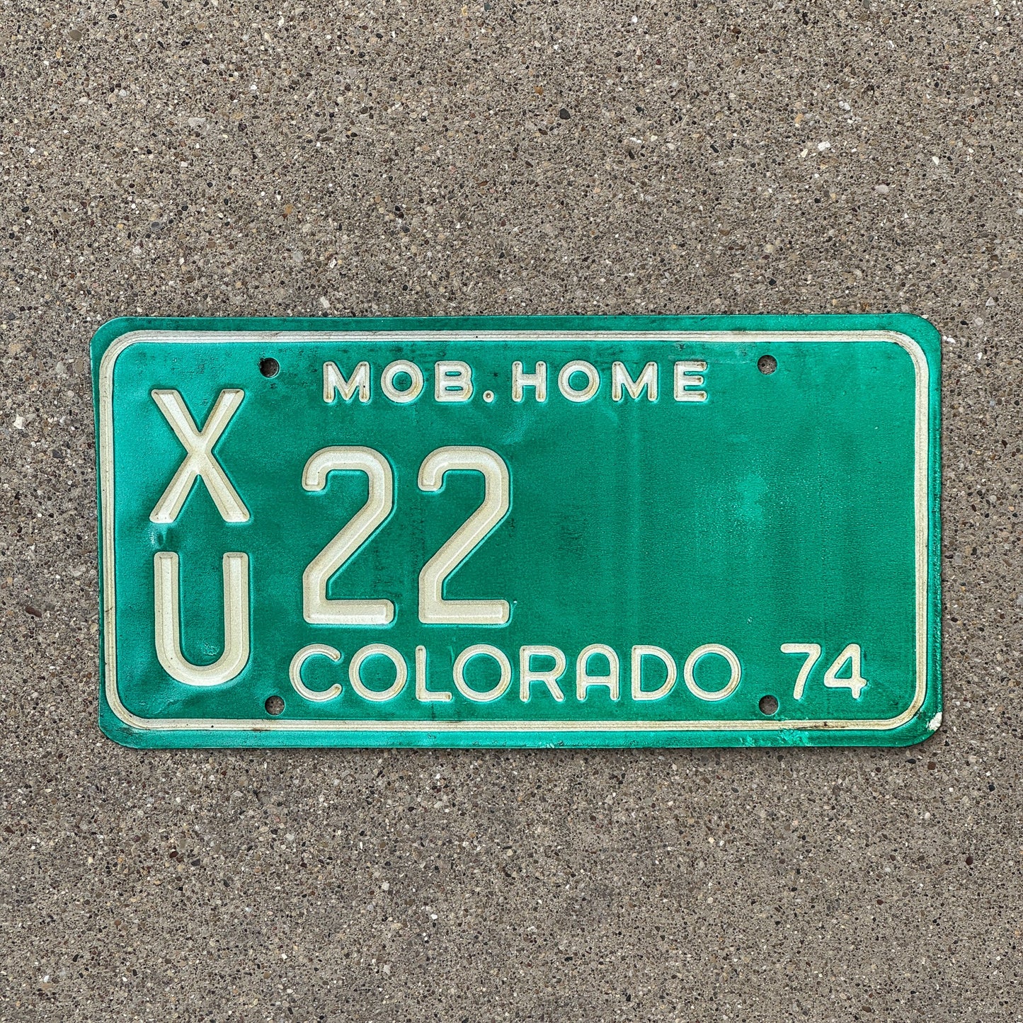 Photo of a 1974 Colorado Mobile Home License Plate Auto Tag Garage Decor Vintage XU 22