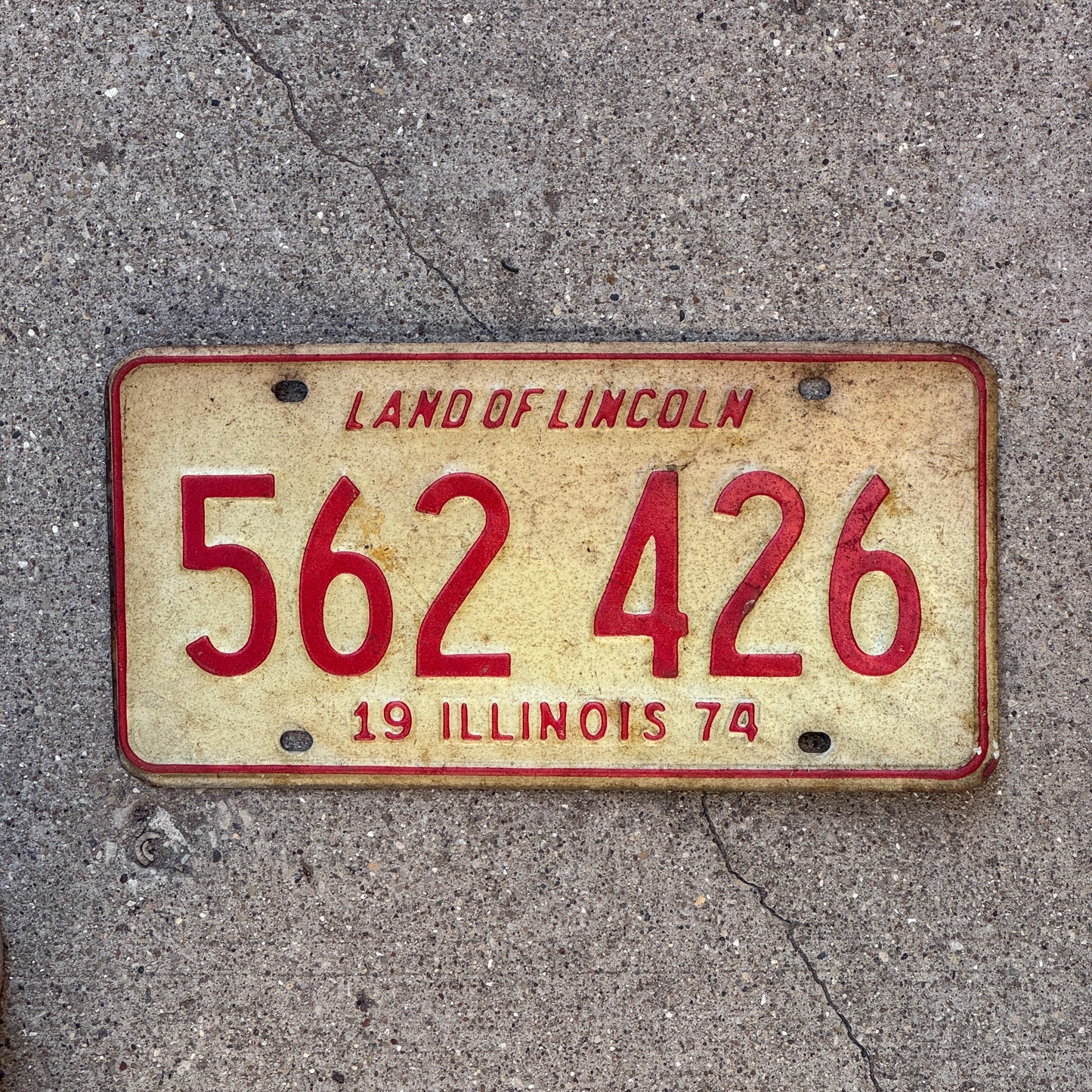 Photo of a 1974 Illinois License Plate Auto Tag Garage Decor Vintage 562 426 with original patina