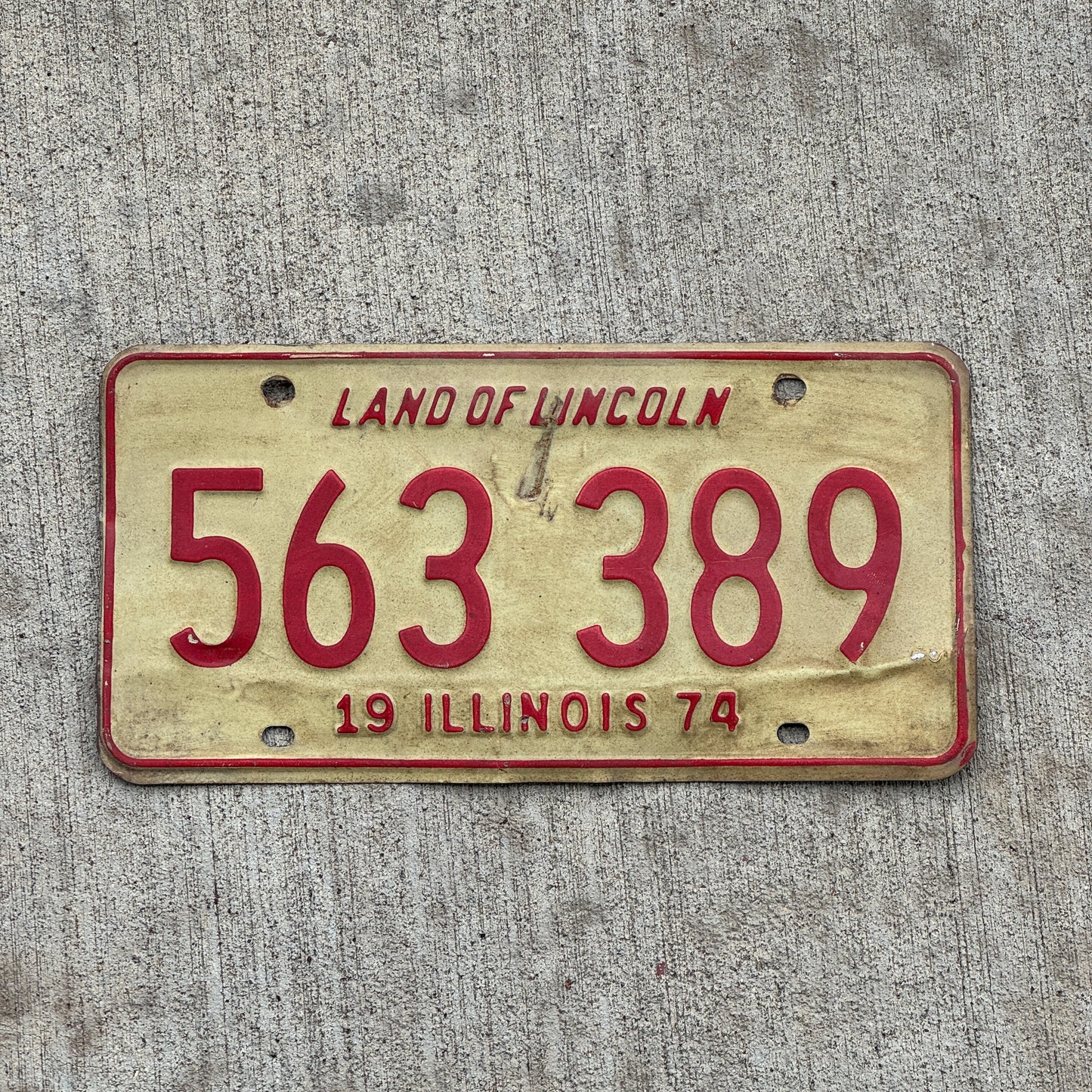 Photo of a 1974 Illinois License Plate Auto Tag Garage Decor Vintage 563 389 with original patina