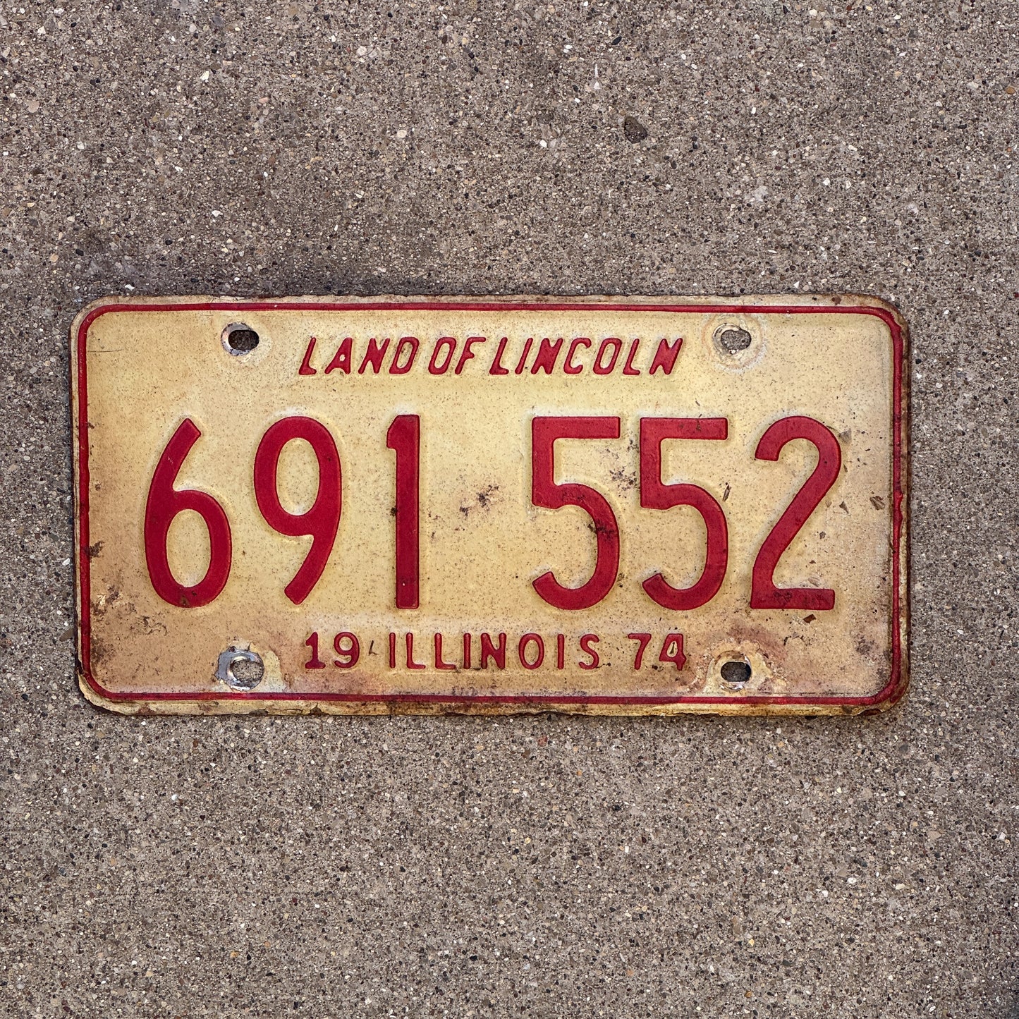 Photo of a 1974 Illinois License Plate Auto Tag Garage Decor Vintage 691 552 with original patina