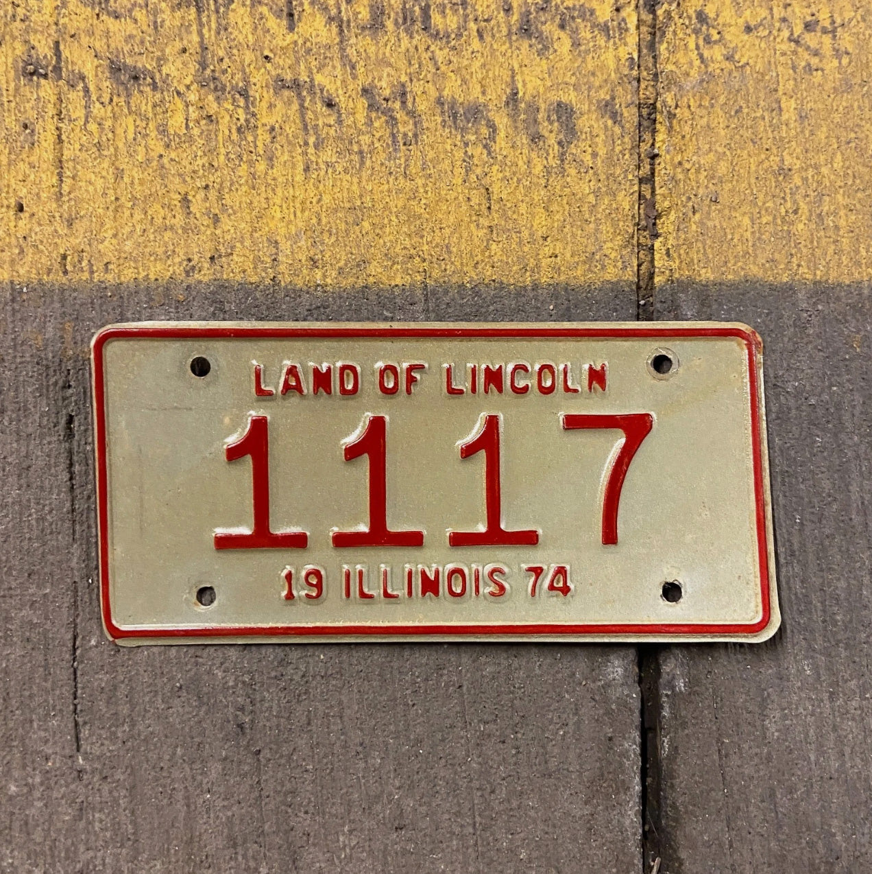 Photo of a 1974 Illinois Motorcycle License Plate Auto Tag Garage Decor Vintage Low Number Four Digit 420 Weed 1117 with original patina
