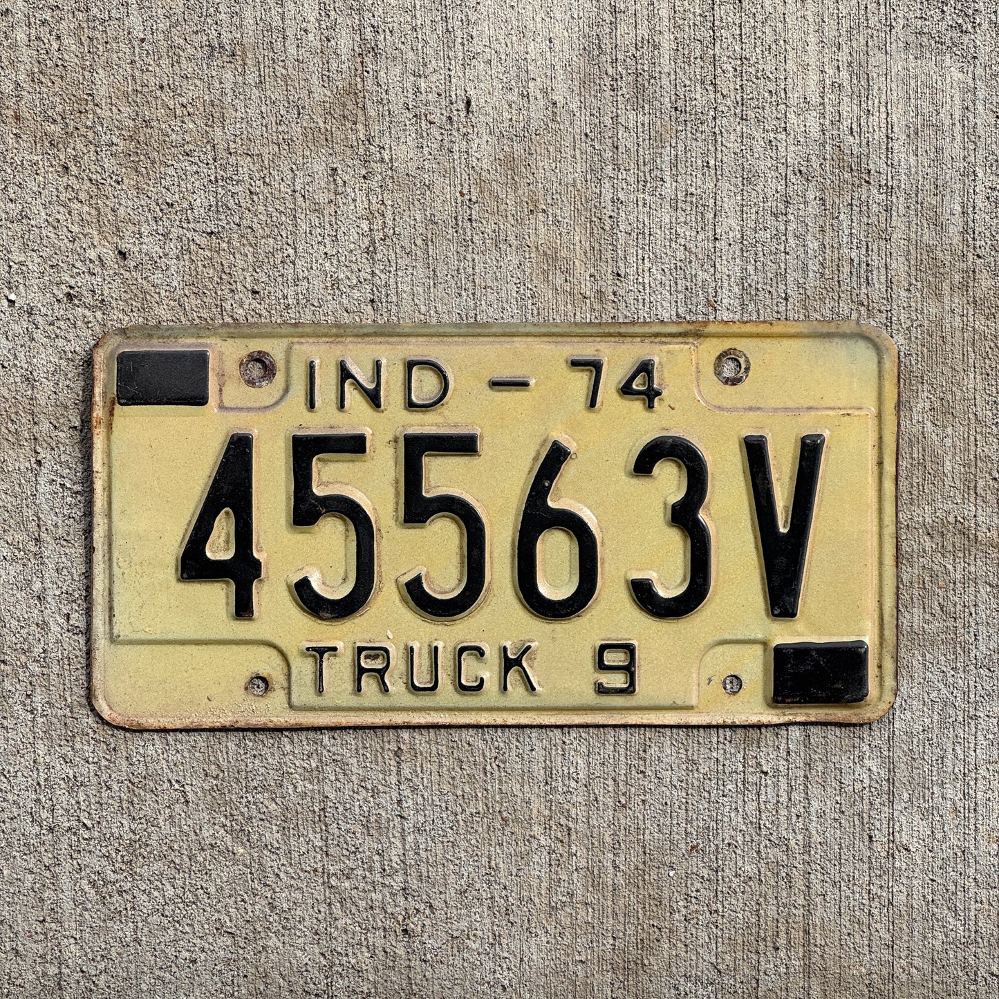 Photo of a 1974 Indiana Truck License Plate Auto Tag Garage Decor Vintage 45563 V with original patina