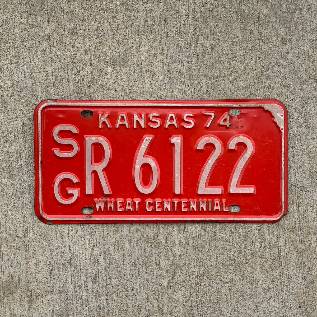 Photo of a 1974 Kansas License Plate Auto Tag Garage Decor Vintage SG R 6122 with original patina