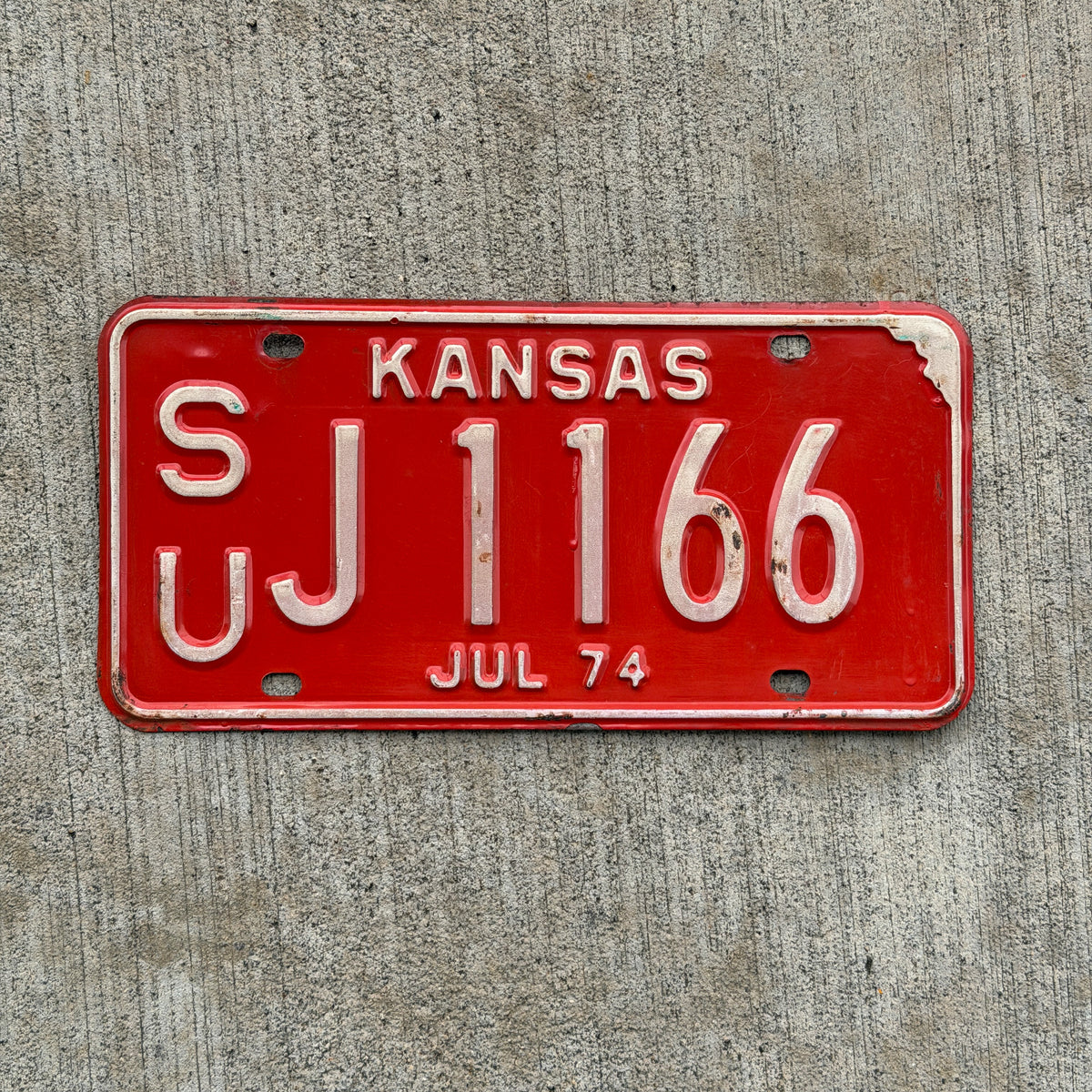 Photo of a 1974 Kansas License Plate Auto Tag Garage Decor Vintage SU J 1166 with original patina