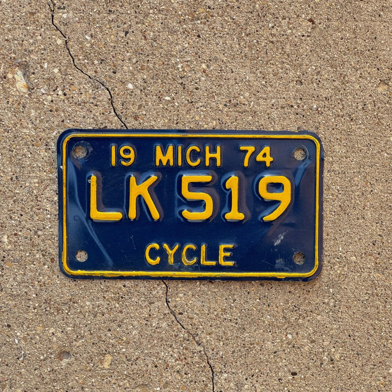 Photo of a 1974 Michigan Motorcycle License Plate Auto Tag Garage Decor Vintage LK 519