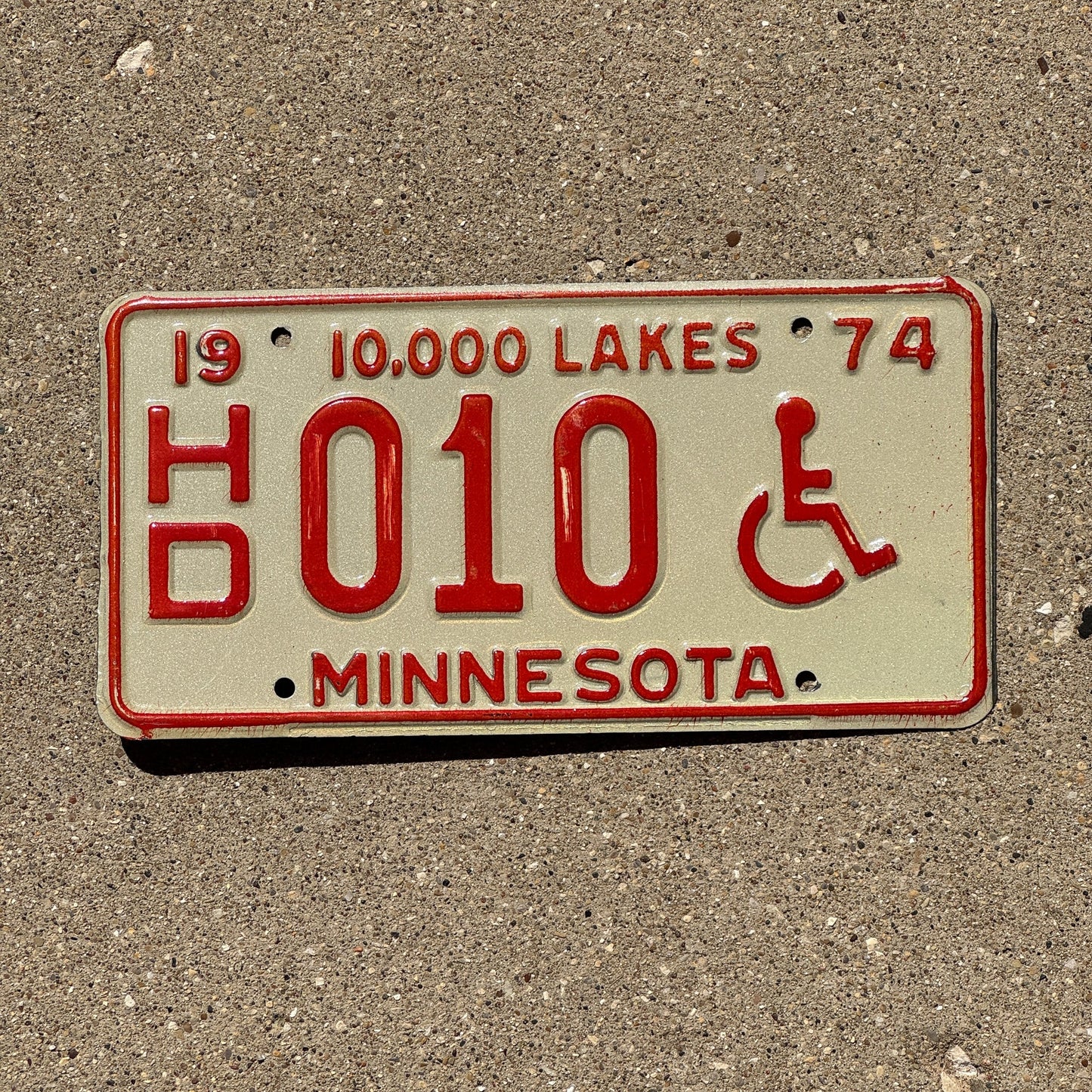 Photo of a 1974 Minnesota Handicapped License Plate Auto Tag Garage Decor Vintage Low Number Two Digit HD 010