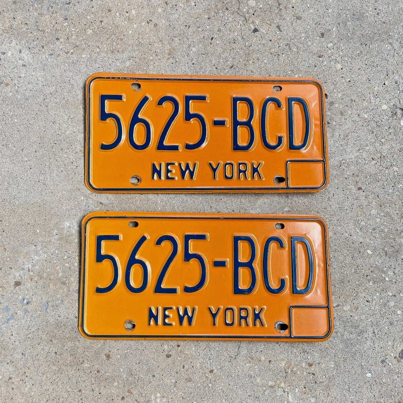 Photo of a 1974 New York License Plate Pair Auto Tag Garage Decor Vintage YOM DMV Clear 5625 CD with original patina
