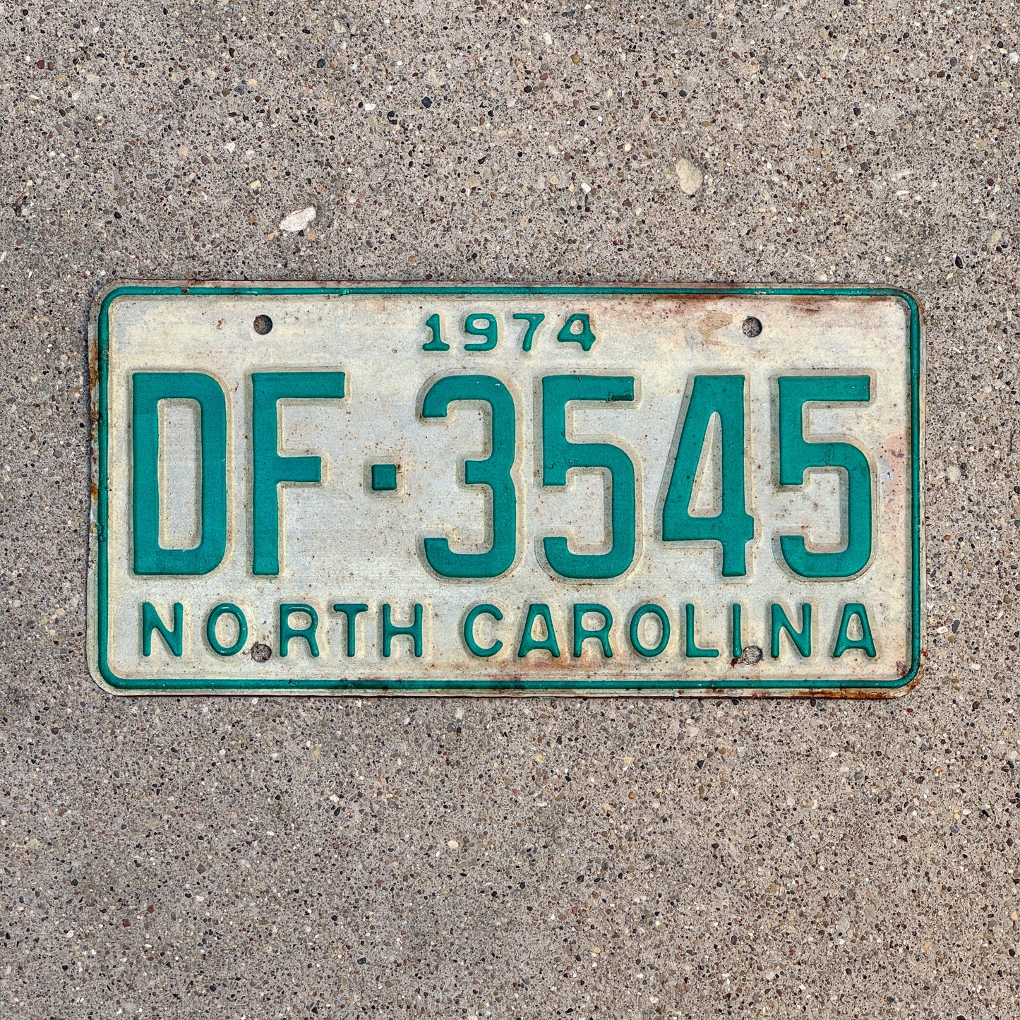 Photo of a 1974 North Carolina Truck License Plate Auto Tag Garage Decor Vintage DF 3545 with original patina