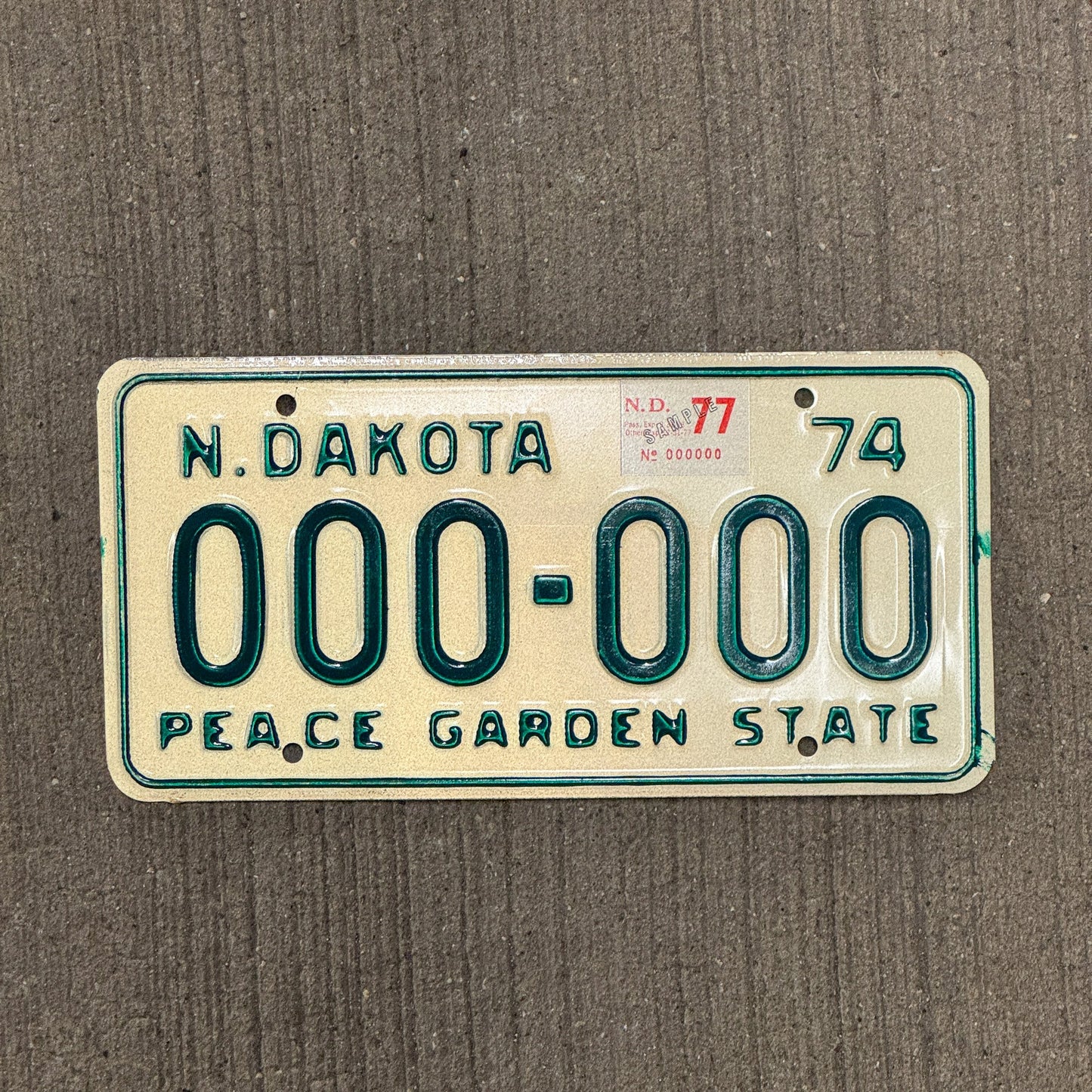 Photo of a 1974 North Dakota SAMPLE License Plate Auto Tag Garage Decor Vintage 000 000